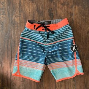 Boys striped Hurley swim trucks in good condition